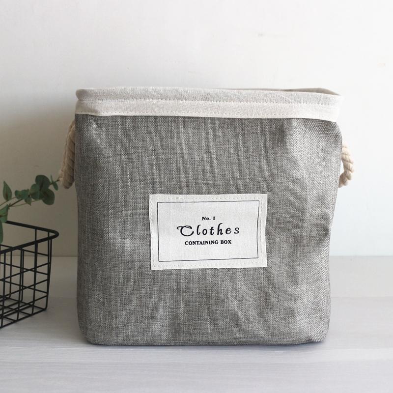 bac à linge design gris en tissu 